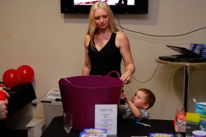 Tony's daughter and grandson help with the door prizes