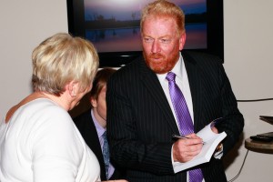 Tony Inman signs a book at his book launch event